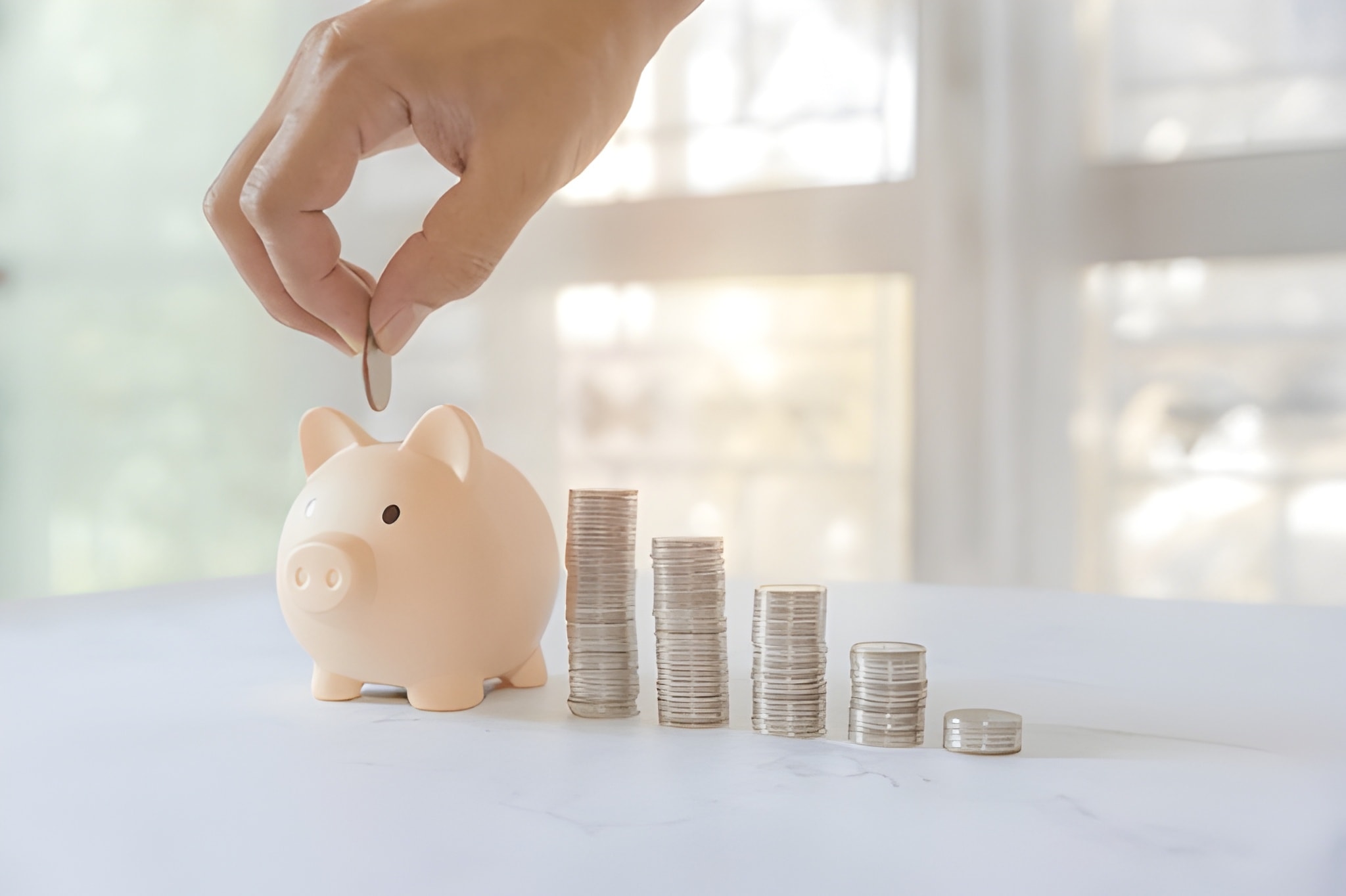 Person reviewing savings plan documents with calculator and laptop, highlighting common financial planning mistakes to avoid.